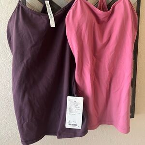 2 Lululemon Coral and deep Purple workout Tanks
New w tags
